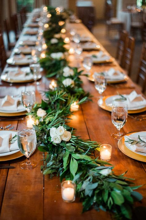 Rustic garland and candle covered wedding tables: http://www.stylemepretty.com/virginia-weddings/madison-virginia/2016/09/09/indoor-charlottesville-farm-style-wedding/ Photography: Ashley Cox - http://ashleypcox.com/ Wedding Reception Table Decorations, Rustic Wedding Decorations, Deco Champetre, Reception Table Decorations, Tafel Decor, Romantic Lighting, Wedding Reception Tables, Wedding Table Decorations, Long Table