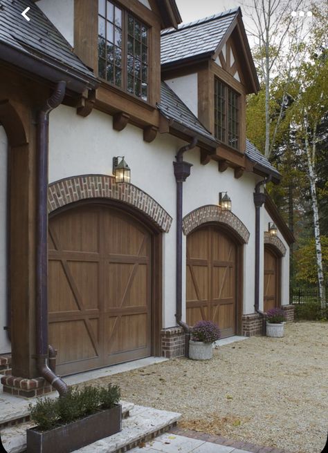 Tudor Garage, Tudor House Exterior, Contemporary Garage Doors, Commercial Lighting Design, Garage Door Types, Garage Door Styles, Garage Exterior, Tudor Revival, Garage Door Design