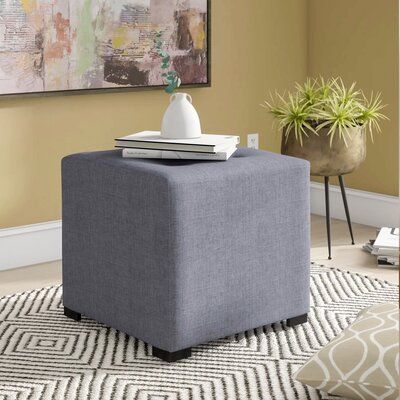 A true style chameleon, ottomans adapt to their surroundings in any setting. One minute they’re a footrest; the next, they’re disguised as an impromptu table or spare seat. This Kirschbaum Tufted Cube Ottoman well with modern and contemporary aesthetics. It is made in the USA, with the frame material deriving from solid and manufactured wood, upholstered with fabric in a solid color, and features button tufting on the top. It measures 17'' H x 19'' W x 19'' D. Upholstery: Dark Gray | Red Barrel Ottoman Makeover, Ottoman Upholstery, Microfiber Sofa, Round Storage Ottoman, Tufted Storage Ottoman, Upholstered Storage Bench, Cube Ottoman, Leather Pouf, Ottoman In Living Room