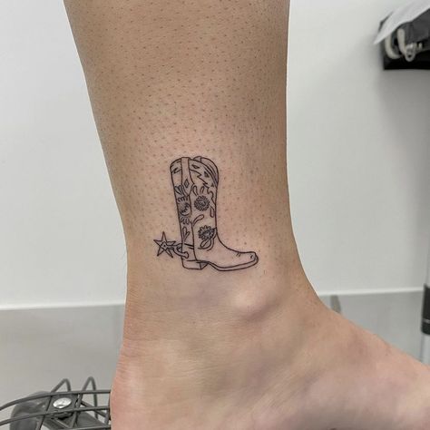 Cowboy Boot Tattoo Ankle, Cowboy Boot Tattoo Men, Mini Cowgirl Boot Tattoo, Minimal Cowboy Boot Tattoo, Small Cowboy Boot Tattoo For Women, Cowboy Boot With Spur Tattoo, Cowboy Boot Tattoo With Spur, Shin Tattoos For Women, Cowboy Boots Tattoo