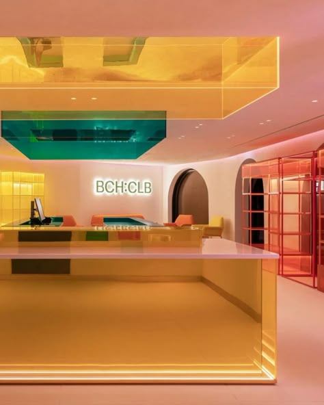 Beach club Hotel is located in Dubai, United Arab Emirates is within the prestigious W Hotel at Palm Jumeirah. At the heart of this project lies our innovative lighting design, aimed at creating immersive spaces where the ambiance can be effortlessly transformed through the power of light. #lovethatdesign #beachclubdesign #lighting #neon Bold Colors Interior Design, Queer Interior Design, Bank Counter Design, Memphis Design Interior, Neon Interior Design, Hotel Reception Design, Entrance Lobby Design, Immersive Design, Car Showroom Interior