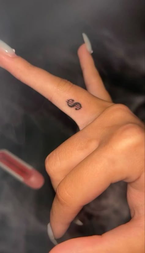 Money Sight Tattoo, Money Sign Tattoo On Finger, Red Dollar Sign Tattoo, Tattoos Fingers Woman, Coin Size Tattoo, Dollar Sign Finger Tattoo, Small Hand Tats For Women, Hot Small Tattoos, Money Tattoo Ideas For Women