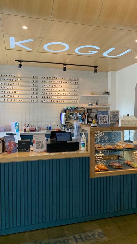 Teal Coffee Shop, Blue Bakery Aesthetic, Blue Cafe Interior, Blue Cafe Aesthetic, Barista Counter, Yellow Coffee Shop, Cafe Shop Design Ideas, Kiosk Cafe, Interior Shop Display