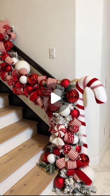 Jeanna Crawford on Instagram: "If this ribbon and garland isn’t giving candy cane lane then I don’t know what is ❤️😘  This full garland look is available to shop at the ShopWithJLC link in my bio 🎁  My giant candy cane is from Sullivans Faves & Candy Ornaments are from Vickerman Selects (You can use my code: QueenOfChristmas for both 🎁😘) . . . #christmas #christmasdecor #christmasdecorations #christmasdecorating #candycane #candycanes #christmasgarland #garland #staircasegarland" Candy Cane Lane Christmas Decor, Candy Cane Garland, Candy Cane Tree, Giant Candy Cane, Christmas Staircase, Candy Cane Lane, Candy Cane Christmas Tree, Giant Candy, Candy Ornaments