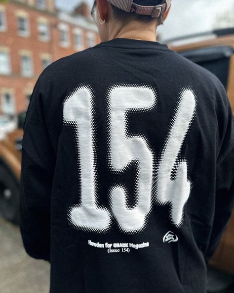 To celebrate the launch of Issue 154, we've created a long-sleeve tee in collaboration with East London MC and grime originator, Flowdan. The tee is a black oversized long-sleeve with football-inspired graphics in white puff print, which read "Flowdan" (front) and "154" (back). Screenprinted in Bristol. Oversized fit, heavy jersey with dropped shoulders. Made from 100% Organic Cotton grown without chemical fertilisers, pesticides or GMOs. Care Instructions: We advise washing inside out on a cool Puff Print Streetwear, Graphic Tee Inspiration, Clothing Brand Design Graphics, Cool Merch, Shirt Advertisement, Football Jersey Shirt, Cool Graphics, Hoodie Drawing, Jersey Tshirt