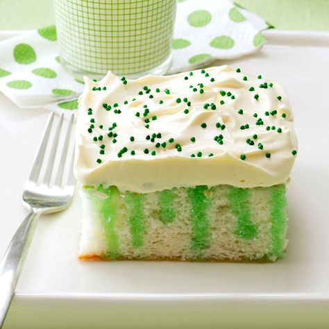 Wearing o' Green Cake Recipe -One bite of this moist, colorful cake and you'll think you've found the pot o' gold at the end of the rainbow. It's the perfect dessert to round out your St. Patrick's Day feast. —Marge Nicol, Shannon, Illinois St Patricks Day Cakes, Jello Cake, St Patricks Day Food, Green Cake, White Frosting, Poke Cakes, Ge Bort, A Piece Of Cake, White Cake Mixes