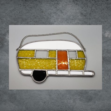 "Are you a camping enthusiast? Is someone you know hooked on camping?  This yellow stained glass camper with a bright orange door will bring a smile to your face as you enjoy past summer memories.  It will certainly be the basis of conversation when you hang one in your camper window while in the campground (remove from window for travel) and in the off-season hang in your window at home, reminding you of the fun times to come when it's camping time again! Yellow not your color?  Check our other Camper Windows, Orange Door, Stained Glass Patterns Free, Yellow Doors, Flower Panels, Camping Lovers, Camper Decor, Shades Of Teal, Stained Glass Designs