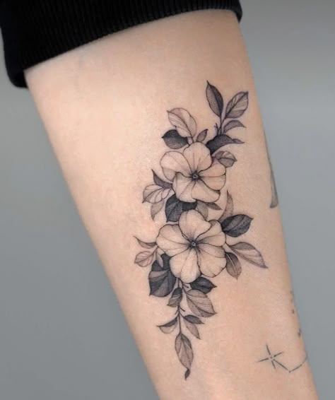 Love the varying light, medium, and dark shades of the leaves making the flowers pop in this example. Flower Without Stem Tattoo, Violet Flowers Tattoo, Tattoos Back Of Arm, Tattoo Wreath, Violet Tattoo Flower, Primrose Tattoo, Jasmine Flower Tattoo, Violet Flower Tattoo, Small Flower Tattoos For Women