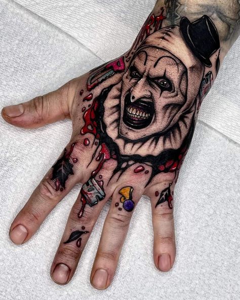 Wrist Forearm Tattoo Men, Ghostface Hand Tattoo, Skull On Hand Tattoo Design, Jigsaw Tattoo Design, Matching Clown Tattoos, Pennywise Hand Tattoo, Creepy Hand Tattoos, Halloween Hand Tattoos, Terrifier Tattoo Ideas