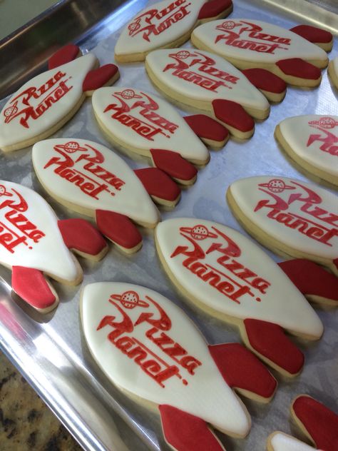 Pizza planet rocket cookies, toy story birthday. Pizza Planet Cake, Pizza Planet Cookies, Pizza Planet Birthday Party, Pizza Planet Theme Party, Pizza Planet Toy Story Party Ideas, Pizza Planet Party Decorations, Toy Story Alien Cookies, Pizza Planet Party, Toy Story Pizza Planet Party