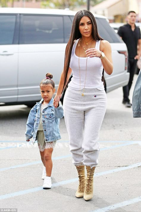 Getting warmer: As things started to heat up in the Southern California city, Kim opted for a basic white tank top and comfortable track pants for their mother-daughter adventure Sweat Pants Outfit, Kim Kardashian And North, Estilo Kim Kardashian, Kim Kardashian Hot, Kim And Kourtney, Kim Kardashian Outfits, Kim K Style, Kardashian Outfit, Oufits Casual