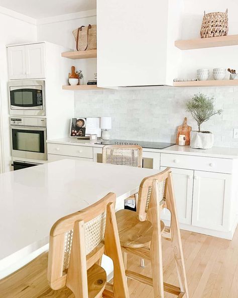 7+ Luxurious Farmhouse Kitchen Hood Ideas for a Statement Look Light Wood Floating Shelves, Farmhouse Kitchen Hood, White Cabinets And Countertops, Luxurious Farmhouse, Kitchen Hood Ideas, Cane Chairs, Kitchen Vent Hood, Patterned Tile Backsplash, Hood Ideas