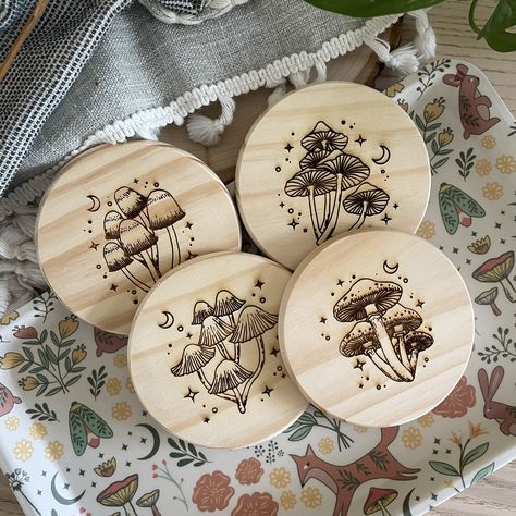 "Our Magic Mushroom Coasters are engraved on 4X4 pine wood, 0.35 inches thick. They are unfinished for a more rustic, unpolished, natural look and feel.  These are the perfect gift and addition to any mushroom lover, and lovers of the magic, the mystical, the witchy, and the psychedelic. They are also available on cork and walnut wood for different finished and styles.  Unfinished Pine Wood Coaster: -4\" Diameter Coasters -0.35\" Thick Coasters  -Handcrafted in Orlando Dark Walnut Wood Coaster: -4\" Diameter Coasters -0.6\" Thick Coasters  Natural Cork Coaster: -3.5\" Diameter Coasters -0.13\" Thick Coasters  Customization Looking to customized your Magic Mushroom Coasters? Send us a message and let us know how we can help!" Woodburned Gifts, Wood Burning Mushrooms, Woodburn Mushroom, Wood Burning Mushroom Design, Wooden Coasters Wood Burning, Wood Burning Coasters, Cottage Core Wood Burning, Cottagecore Wood Burning, Mushroom Coaster