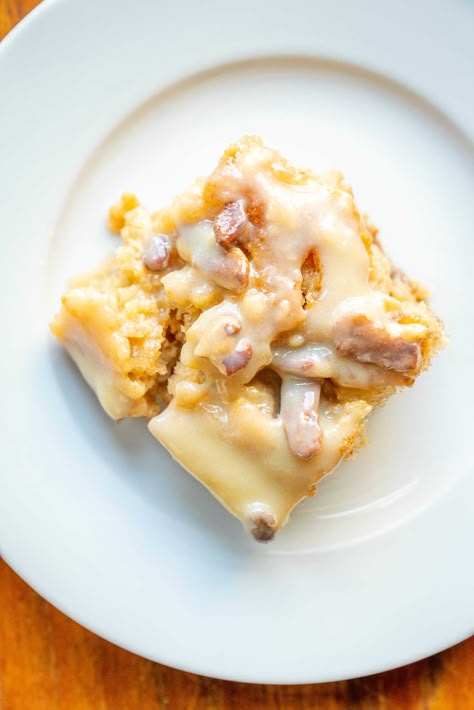 Butter Pecan Praline Poke Cake?utm_source=12tomatoes Butter Pecan Praline Cake, 12 Tomatoes Recipes Desserts, Butter Pecan Praline Poke Cake, Pecan Praline Poke Cake, Praline Poke Cake, Cake Poke, Pecan Praline Cake, Praline Cake, Pecan Praline