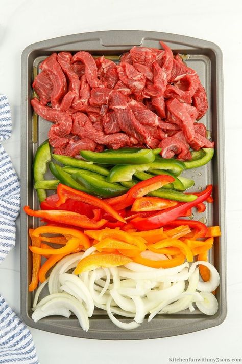 Fajitas are one of my favorite meals and are sure to become yours with this recipe. This Sheet Pan Steak Fajitas recipe is so good and will feed your whole family. With a few simple ingredients, you will have a delicious meal ready to serve in no time. Sheet Pan Flank Steak Fajitas, How To Cook Fajita Meat, Sheetpan Fajitas Beef, Steak Fajita Casserole Recipe, Sheet Pan Beef Fajitas, Fajitas Steak, Sheet Pan Steak Fajitas, Baked Fajitas, Steak Fajitas Recipe