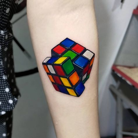 25 Playful Toy Tattoos That Will Make You Feel Like a Kid Again | Toy tattoos are a thing and they celebrate the most beloved childhood items that we all know and played with growing up. See if you have played with them all! Lifestyle Rubix Cube Tattoo, Cube Tattoo, Rubicks Cube, Nintendo Tattoo, Tattoo Hair, Rainbow Tattoos, Rubix Cube, Tatuaje A Color, Alternative Makeup