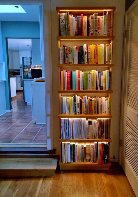 "A clean well-lighted place for books." Meet the lighted bookcase, cookbook edition. This is my weekend project in a finished state. The LED's are embedded in each shelf with all the wiring hidden through channels and holes bored the full depth of each shelf. The unit just plugs into a wall socket. A dimmer switch is installed on the left side.  My current best example of furniture as ambient light fixture. Book Rack Design, Creative Shelving Ideas, Wooden Pallet Beds, Pallet Bookshelf, Pallet Wood Shelves, Bookshelf Lighting, Bookshelf Plans, Wooden Room, Moody Bedroom