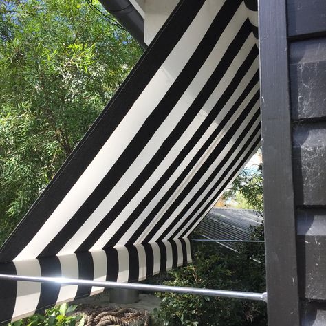 PIVOT ARM AWNINGS | NORTHSHORE CANVAS Striped Window Awnings, Striped Awning House, Black And White Awning, Stripe Awning, Striped Awning, Black Pergola, Spending Budget, Exterior Blinds, Canvas Awnings