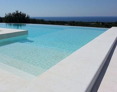 capri white limestone bulnose poo coping tiles and pavers, white pavers, outdoor pavers by stone pavers Bullnose Coping Around Pool, Pool Limestone Pavers, White Swimming Pool Tiles, Outdoor Pool Tiles, White Tiled Pool, White Pool Area, Limestone Pool Paving, Limestone Pool Coping, White Tile Pool