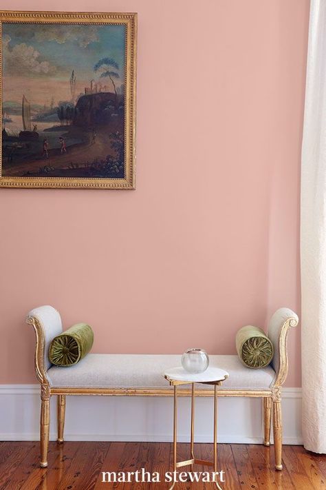 This perfect pink paint color is an updated take on the Millennial pink shade that you can use in any room of your home. This muted pink shade looks like the inside of a seashell and is considered a neutral pink paint color that will add some warmth and charm to your space. #paintcolors #marthastewart #paintideas #paintcolorideas #bestpaintcolors #homeinspiration Neutral Pink Wall Color, Neutral Pink Bedroom, Muted Pink Bedroom, Pastel Color Wall, Pastel Wall Color, Mcm Bedroom, Indoor Paint Colors, Pink Painted Walls, Timeless Paint Colors