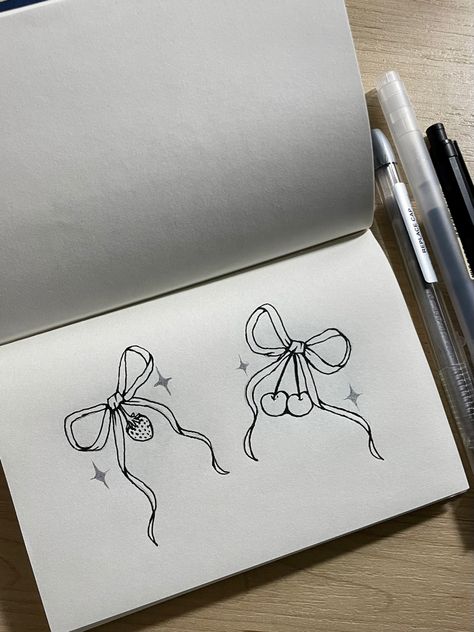 This pin shows a sketch of a matching tattoo idea (two related images for tattoo reference) and depicts two bows, one with a strawberry and one with cherries attached Bow Matching Tattoo, Matching Cherry Tattoos, Matching Bow Tattoos, Cherry Bow Tattoo, Matching Tattoo Idea, Girly Doodles, Matching Tats, Bow Tattoo, Sweet Tattoos