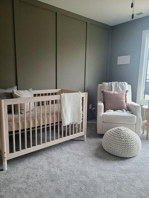 Baby nursery rocker crib room accent wall green paint cozy Greens For Nursery, Green And Dark Wood Nursery, Green Feature Wall Nursery, Sage Green And Brown Nursery, Baby Boy Nursery Sage Green, Gender Neutral Green Nursery, Baby Nursery Accent Wall, Nursery Green Accent Wall, Nursery Green Walls