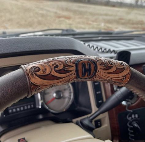 Punchy Truck Accessories, Tooled Leather Steering Wheel Cover, Tooled Leather Projects, Leather Tooling Ideas, Western Truck Accessories, Truck Interior Ideas, Western Car Accessories, Truck Interior Accessories, Custom Steering Wheel