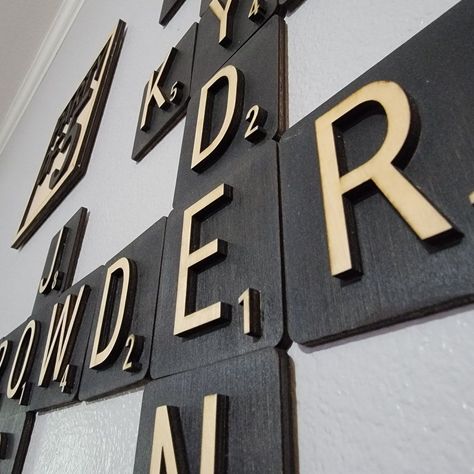 Custom wood wall art featuring family names in Scrabble tile format, perfect for adding a personalized and playful touch to your home decor.#WallDecorTrends #HomeDecor #LaserCutting #InteriorDesign #DIYDecor #CustomWallDecor #WallDecorIdeas #LaserCutWallDecor Game Area Ideas, Family Wall Ideas, Scrabble Family Names, Wood Design Wall, Scrabble Wall Decor, Large Scrabble Tiles, Laser Cut Wall Decor, Scrabble Tile Wall Art, Kitchen Wall Decor Ideas