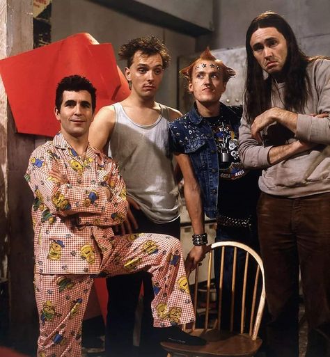 The Young Ones is a British sitcom written by Rik Mayall, Ben Elton, and Lise Mayer, starring Adrian Edmondson, Mayall, Nigel Planer, Christopher Ryan, and Alexei Sayle, and broadcast on BBC Two for two series, first shown in 1982 and 1984. The show focused on the lives of four dissimilar students and their landlord's family on different plots that often included anarchic, offbeat, surreal humour. British Sitcoms, Rik Mayall, The Young Ones, British Humor, Classic Comedies, British Comedy, British Tv, Comedy Tv, Teenage Years