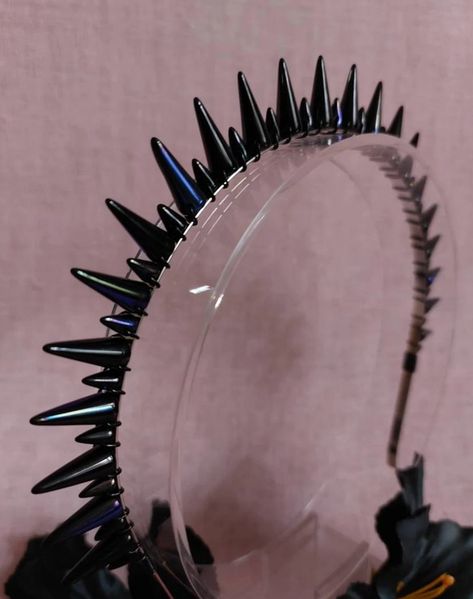 Blue black double spike halo headband made with Czech preciosa glass spike beads on a silver headband and black wire.

The spikes are black with a blue/purple sheen and are about 16mm and 8mm tall respectively. The tall spikes are slightly taller than the ones used in the Rock And Folly classic spiky, which you can view here: Goth Headband, Grunge Ideas, Fairycore Grunge, Halo Crown, Halo Headband, Punk Accessories, Silver Headband, Pastel Goth, Punk Rock