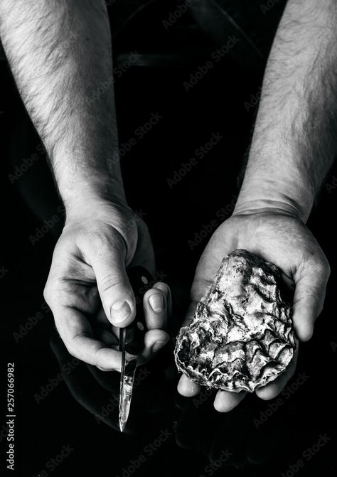 Download hands open the oyster with a knife Stock Photo and explore similar images at Adobe Stock. Hands Open, Adobe Stock, Stock Photos