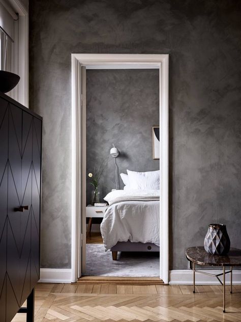 Simple bedroom with a mineral paint Dark Grey Feature Wall, Concrete Walls Diy, Swedish Bedroom, Grey Feature Wall, Home Color Palettes, Lime Wash Walls, Light Wood Bed, Limewash Walls, Lime Plaster