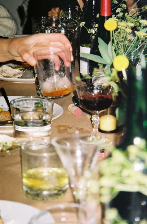 Friends dining in a narrow alley between two houses and sipping on craft cocktails and natural wine waiting for the next course. Kodak Gold 35mm through the Pentax iQ ZOOM Point and Shoot. messy chic, action shot Messy Chic, Restaurant Photography, Kodak Gold, Natural Wine, Supper Club, Dinner With Friends, Wine And Dine, Flash Photography, Craft Cocktails