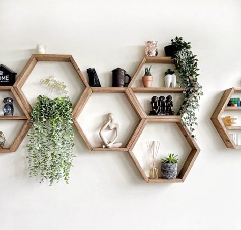 These oversized hexagons are the perfect wall accent for any room. Perfect for plants, books, etc. WHAT IS INCLUDED -1 to 5 hexagon shelves, depending how many you select -nails are included for easy hanging.. you can use 1 or 2 for each hexagon, depending on how heavy the items are that are sitting on them (see instructions below) HOW ARE THEY BUILT These hexagons are built extremely secure. They are joined with biscuit joints, as well as nails and wood glue for maximum strength. We added the b Hexagon Shelves Stairway, Wooden Astetic Room, Simple House Decorating Ideas, Hexagonal Shelves Decor, Hexagon Shelves Living Room, Condo Interior Design Small Minimalist, Hexagon Shelves Decor, Greenery Room Decor, Hanging Shelves Living Room