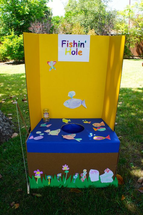 Fishing game for carnival birthday party.  I am sure I could make something like this! wonder if instead of someone having to put the treat on, if you could use ziplocks with some kind of magnet.... Go Fishing Carnival Game Booth Ideas, Ice Fishing Game For Kids, Booth Games For Kids, Finding Nemo Birthday Party Games, Fishing Game Carnival, Go Fish Carnival Game, Fishing Booth Carnival Game, Finding Nemo Party Games, Fall Festival Fishing Game