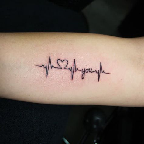 Popularly known as the EKG line tattoo, the pulse symbol is similar to a little monitor with an irregular line that bounces up and down just like when a patient is hooked to a heart… Heart Rate Tattoo, Heartbeat Tattoo With Name, Pulse Tattoo, Heartbeat Tattoo Design, Tattoos For Women Small Meaningful, Heartbeat Tattoo, Female Tattoos, Shape Tattoo, Men Tattoos