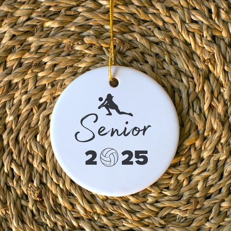 Celebrate your favorite volleyball player or yourself with this thoughtful ornament! A perfect gift for any volleyball senior in your life.  ITEM DETAILS: A circular ornament measured 2.75 inches by 2.75 inches with a golden string to hang it.  ITEM SPECIFICATIONS:  .: 0.125" (3mm) thick high-quality ceramic .: Glossy finish .: One-sided print .: Hole and gold-toned hanging string included .: The height of the hole can slightly deviate .: Please note: Each pack contains a single ornament PROCESS Senior Volleyball Gifts, Volleyball Senior Night Gifts, Senior Volleyball, Volleyball Senior Night, Gifts For Teenage Girls, Girls Volleyball, Senior Night Gifts, Volleyball Gifts, Senior Gifts