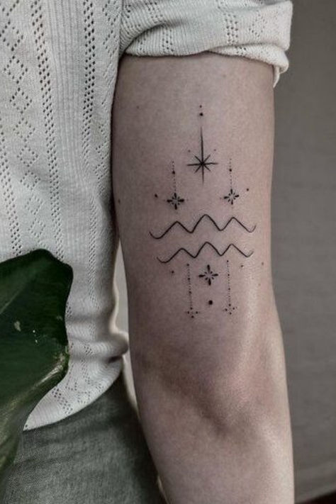 Looking for Aquarius tattoo ideas?! These Aquarius tattoos are STUNNING, whether you want small or large, cute and dainty, we've for the perfect Aquarius tattoo designs here Aquarius Minimalist Tattoo Women, Aquarius Waves Tattoo, Tattoo Ideas Female Aquarius, Aquarius Hand Tattoo, Aquarius Tattoos For Women, Aquarius Tattoo Ideas Unique, Aquarius Tattoo Designs For Women, Aquarius Goddess Tattoo, Aquarius Tattoo Ideas