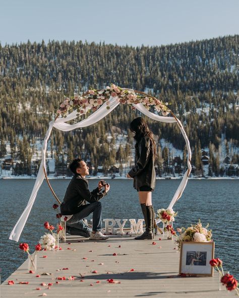 had the honor of documenting l+v’s gorgeous lake tahoe proposal this past weekend! larry and i called a few times leading up to the proposal to coordinate and iron out details. originally he was planning to blindfold vivian but i asked if she would be wearing makeup / lashes (girlies, i gotchu!😉) and he realized that she probably would be, so he had her close her eyes instead while making their way to the dock. the day of, there was some wind which kept blowing the petals and vases off the do... Lake Louise Proposal, Lake Tahoe Proposal, Lake Proposal, Winter Lake, Makeup Lashes, The Proposal, Lake Louise, Boat Dock, Proposal Ideas