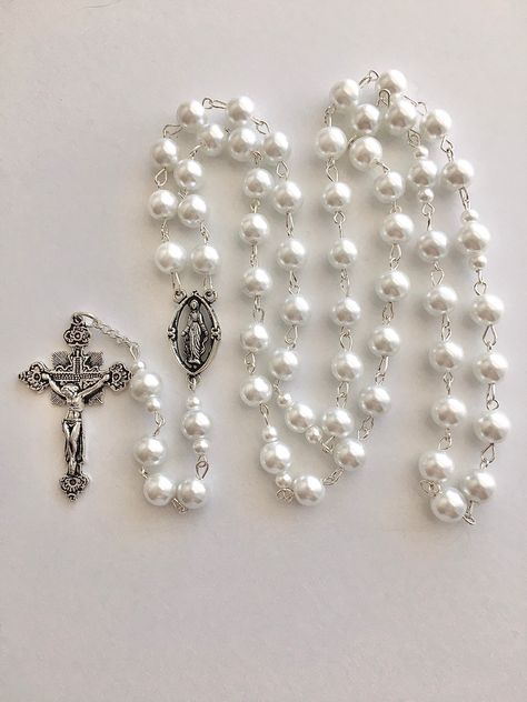 Handmade rosary. Made with silver metal wire and 8mm glass faux pearls. Crucifix measures 1 3/4 inch x 1 1/4 inch. Comes in a gift pouch Baddie Jewelry, White Rosary, Students Gifts, Christian Accessories, Handmade Rosary, Pearl Rosary, Rosary Necklace, Rosary Beads, Gift Pouch