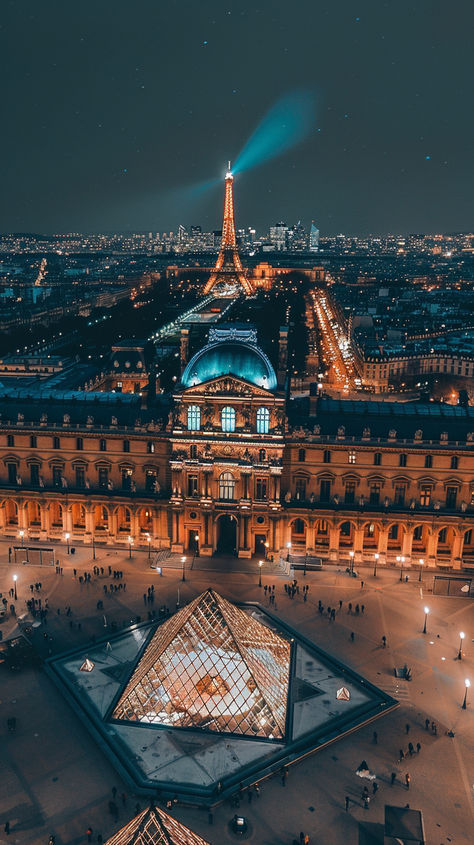 A breathtaking night view of Paris, with the iconic Louvre Museum and its illuminated glass pyramid at the center. The Eiffel Tower glows in the background, while people stroll through the open square that connects historic charm and modern design.🌟🏛️✨ #ParisNights #LouvreMuseum #EiffelTowerView #ParisCityscape #NightViews #HistoricAndModern #LouvrePyramid #CityOfLights #ParisArchitecture #TravelGoals #IconicLandmarks #RomanticParis Glass Pyramid, Louvre Pyramid, Paris Architecture, Romantic Paris, Classic House Design, Louvre Paris, Louvre Museum, Night View, The Eiffel Tower