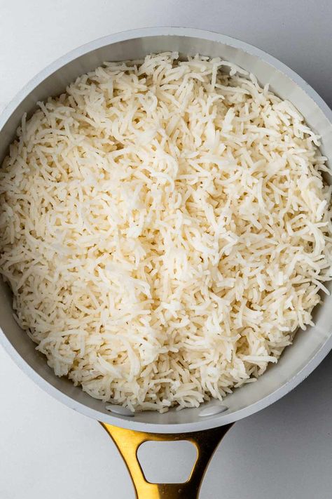 Foolproof recipe on how to cook Basmati Rice perfect and fluffy everytime! An easy stovetop method in 20 minutes. Serve with curries, stir fries, stews and more! Fluffy Basmati Rice, Spiced Basmati Rice, How To Make Basmati Rice, How To Cook Basmati Rice On The Stove, Fluffy Rice How To Make, How To Cook Basmati Rice, Indian Rice Recipes Basmati, White Rice Stove Top, Baked Basmati Rice