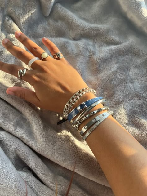 @Iwannag0t0plut0 Silver Rings Stacking, Hand Stacking Bracelet, Good And Silver Jewelry Together, Silver Jewelry Girl, Silver Bangle Stack, Chunky Silver Bracelets, Silver Jewelry Stack Bracelets, Silver Stacked Bracelets, Silver Bangles Aesthetic