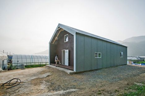 Low Cost Housing by JYA Architects: The house's low-cost timber frame is left exposed internally and clad with sandwich panels finished with corrugated steel sheets. Affordable Homes, Low Cost Housing, Sandwich Panel, Metal Siding, Storage Places, Low Income, Shed Plans, Shed Storage, Storage Shed