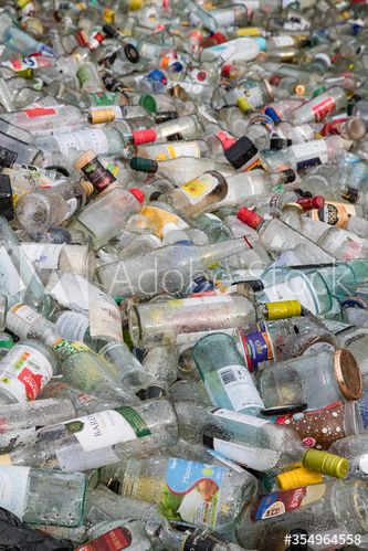 Tralee, Ireland - 6th March, 2019: Empty glass bottles and food containers piled up in a recycling centre #AD , #Empty, #glass, #Tralee, #Ireland, #March Empty Glass Bottles, Recycling Center, Food Containers, Glass Bottles, Recycling, Typography, Stock Photos, Glass