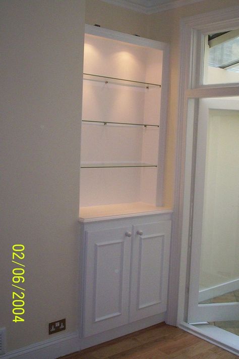 Add light to your recessed shelves for a dramatic touch. Recessed Wall Shelves, Recessed Wall Niche, Dining Room Built Ins, Alcove Shelves, Alcove Storage, Alcove Cabinets, Glass Shelves In Bathroom, Glass Shelves Decor, Recessed Shelves