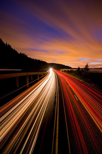 The highway shows movement. Because the road has action on it, with the moving cars and the lights it was taken sped up. Your eyes follow the picture into the distance. Photography Movement, Light Trail Photography, Trail Photography, Light Streaks, Movement Photography, Shutter Speed Photography, Photography Iphone, Blur Photography, Motion Photography