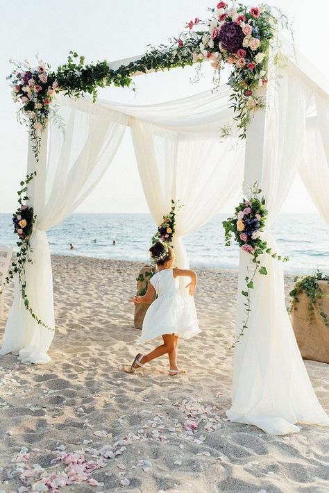 romantic beach wedding ceremony floral arch in pink and purple tones Beach Wedding Arches, Wedding Ceremony Floral Arch, Dreamy Beach Wedding, Destination Wedding Flowers, Beach Wedding Aisles, Beach Wedding Arch, Themed Wedding Decorations, Beach Wedding Ceremony, Romantic Beach Wedding