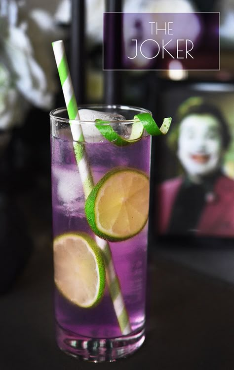 The Joker Serves 1 3 oz. grape Jolly Rancher-infused vodka (see below)  ¼ oz. lime juice Seltzer To make the infused vodka: Unwrap 10–12 purple Jolly Ranchers and put them in a sealable jar or bottle. Add 1½ cups of vodka, seal, shake, and let sit overnight or until candy fully dissolves when you shake the bottle. Chill until ready to use. Batman Cocktails, Purple Cocktails, Infused Vodka, Jolly Rancher, Jello Shots, Drinks Alcohol Recipes, Delicious Cocktails, Alcohol Recipes, The Joker