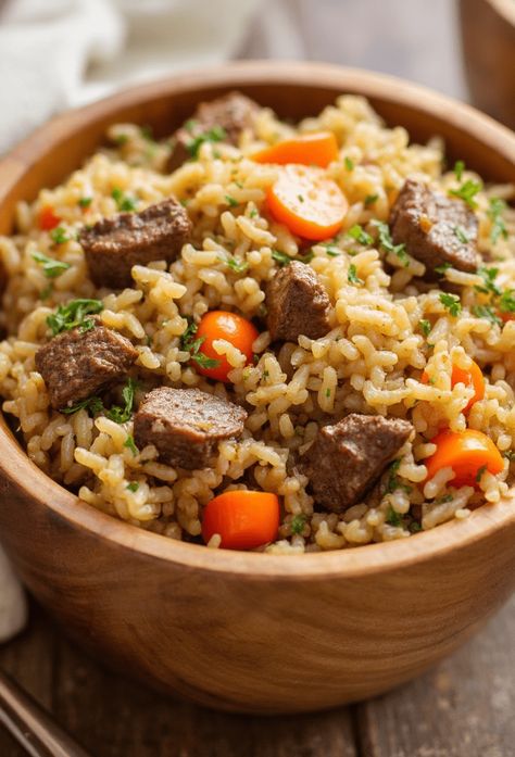 Beef Rice Pilaf Recipe

Ingredients

- 1 pound beef, cubed
- 1 cup long-grain rice
- 2 cups beef broth
- 1 onion, chopped
- 2 cloves garlic, minced
- 1 carrot, diced
- 1/2 cup frozen peas
- 2 tablespoons olive oil
- 1 teaspoon paprika
- Salt and pepper to taste
- Fresh parsley, for garnish

Full Cooking Instructions on... Beef Cubes And Rice Recipes, Beef Rice Pilaf Recipe, Beef Rice Pilaf, Diced Beef Recipes, Rice And Beef, Basmati Rice Recipes, Leftover Roast Beef, Rice Pilaf Recipe, Pilaf Recipe